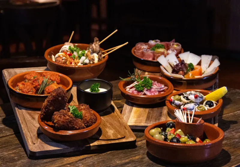 Why Your Tapas Night Always Ends With a Pizza Order (And How Spanish Bartenders Fix That)